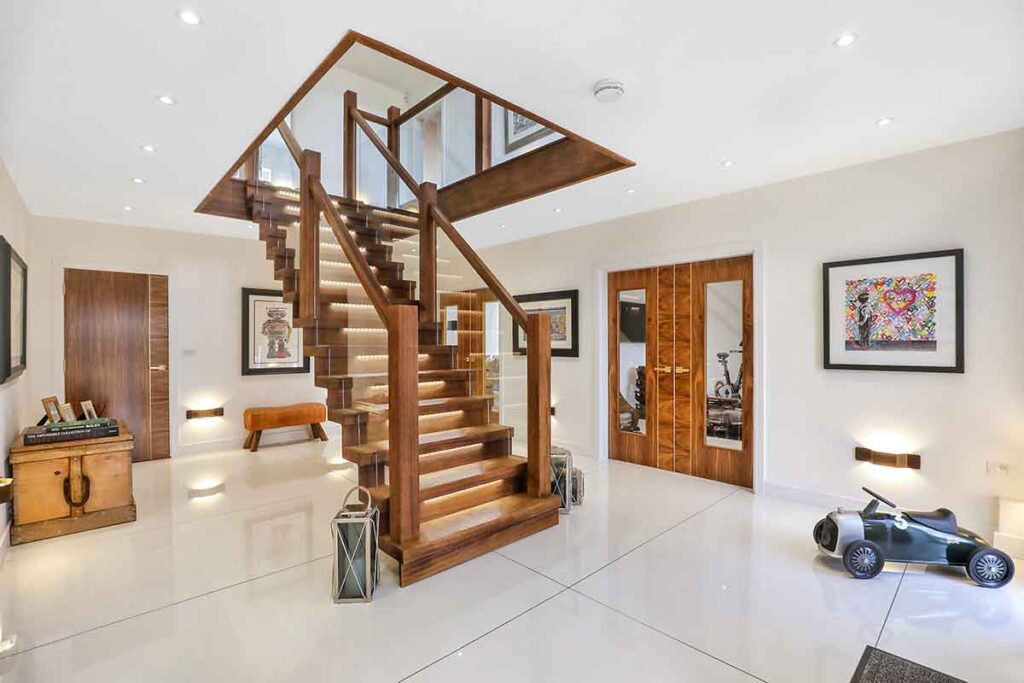 Professional photo of entry hall with large staircase