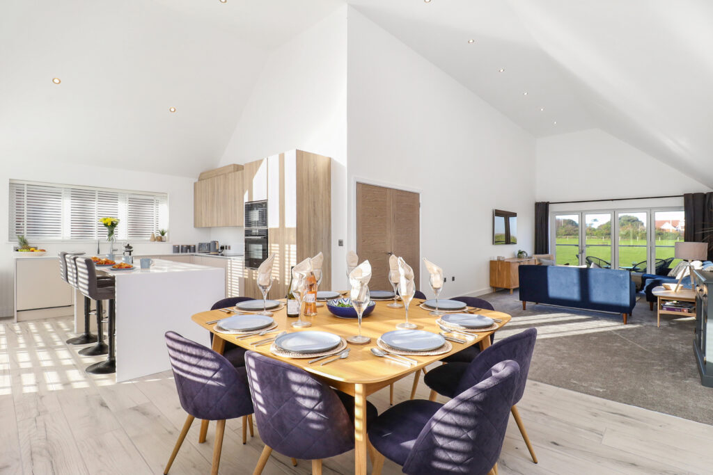 Professional photo of open plan kitchen, dining room and lounge