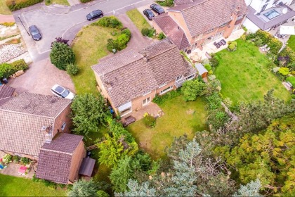 Drone photo of detached house with garden